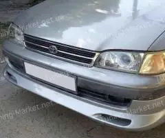 Накладка на передний бампер Toyota Carina E T190, накладки на пороги Тойота Карина Е